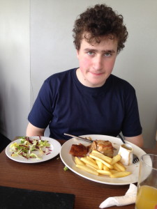 My son attacking a plate of pulled pork